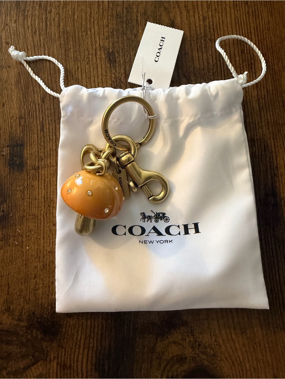 Coach Gold-Tone Keychain with Orange Mushroom Charm - Picture 2 of 3